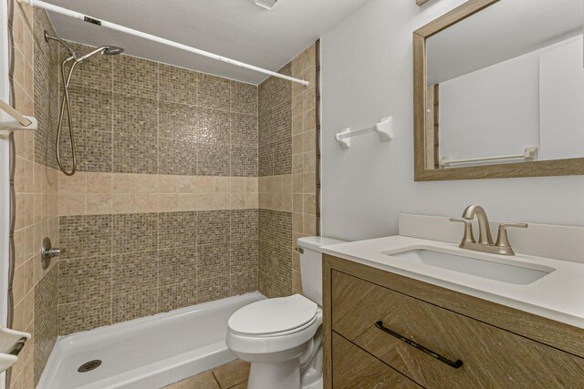 1441 Sheafe Ave NE Unit 104, Palm Bay, FL 32905 - bathroom featuring vanity, a tile shower, and tile patterned flooring