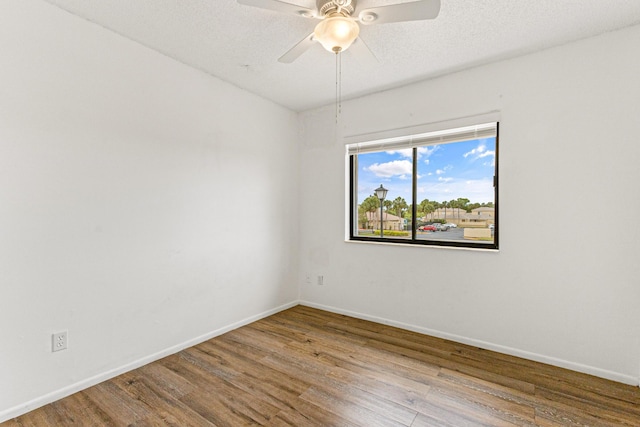 1441 Sheafe Ave NE Unit 104, Palm Bay, FL 32905 - empty room featuring wood finished floors and a ceiling fan