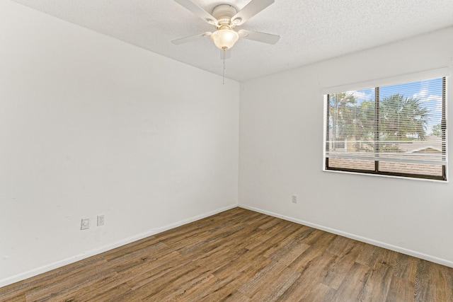 1441 Sheafe Ave NE Unit 104, Palm Bay, FL 32905 - spare room with wood finished floors, a ceiling fan, and a textured ceiling