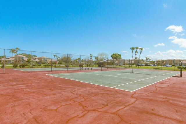 1441 Sheafe Ave NE Unit 104, Palm Bay, FL 32905 - view of tennis court featuring a residential view