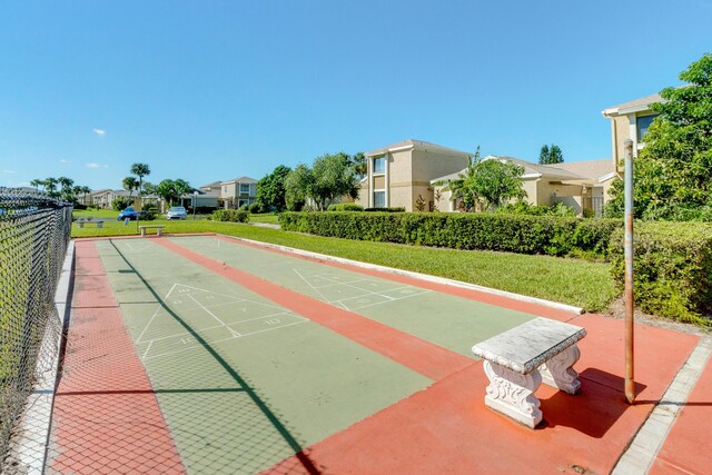 1441 Sheafe Ave NE Unit 104, Palm Bay, FL 32905 - view of community with shuffleboard, a yard, and a residential view