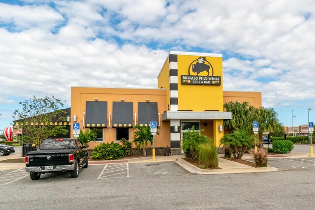 1441 Sheafe Ave NE Unit 104, Palm Bay, FL 32905 - view of commercial property featuring uncovered parking
