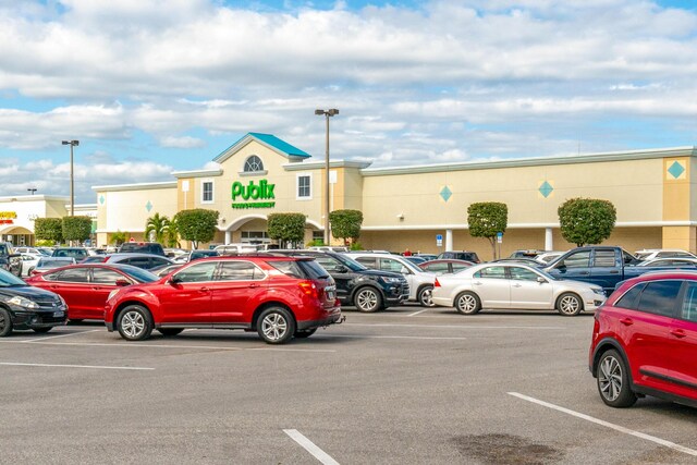 1441 Sheafe Ave NE Unit 104, Palm Bay, FL 32905 - view of uncovered parking lot
