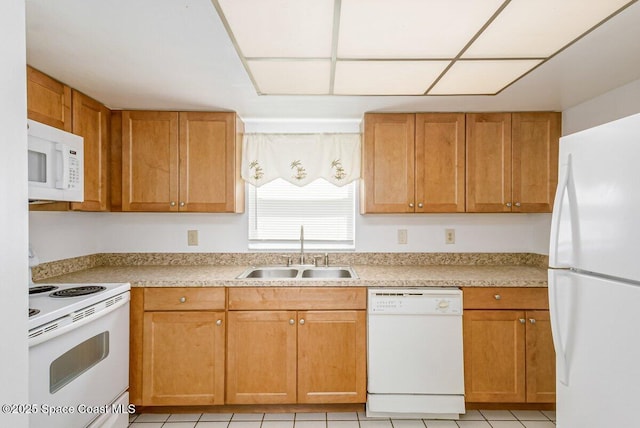 2358 Golf Lake Cir Unit 212, Melbourne, FL 32935 - kitchen featuring white appliances, light countertops, light tile patterned floors, and brown cabinetry