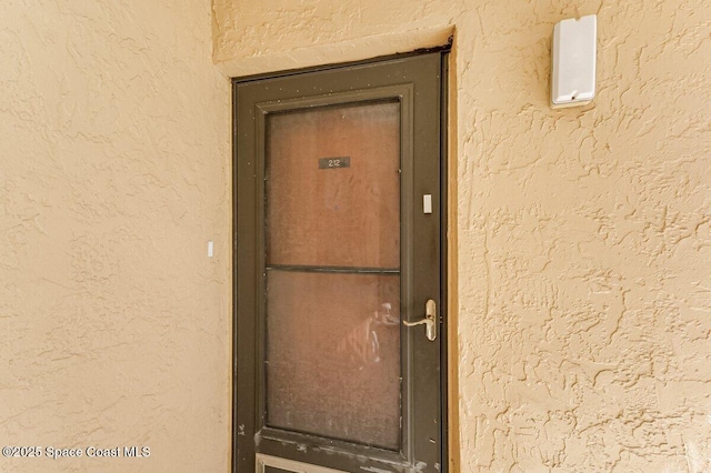2358 Golf Lake Cir Unit 212, Melbourne, FL 32935 - property entrance with stucco siding