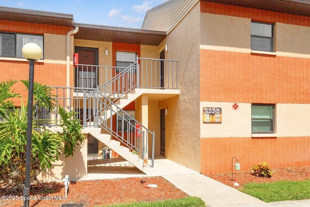 2358 Golf Lake Cir Unit 212, Melbourne, FL 32935 - view of property featuring stairway