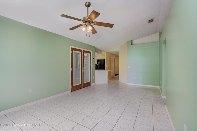 146 Oakcrest Ave NE, Palm Bay, FL 32907 - spare room with vaulted ceiling, light tile patterned flooring, french doors, and ceiling fan