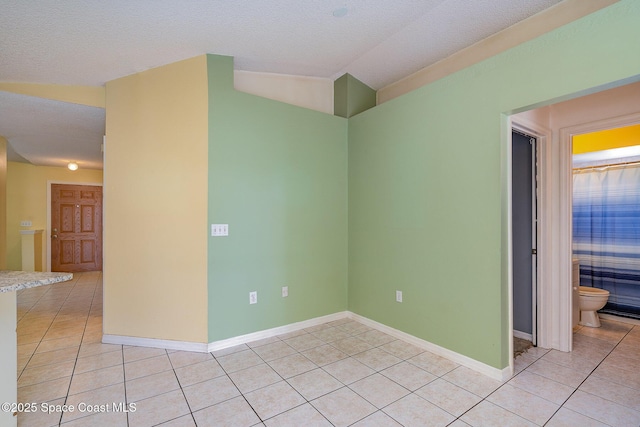 146 Oakcrest Ave NE, Palm Bay, FL 32907 - empty room featuring light tile patterned floors and lofted ceiling