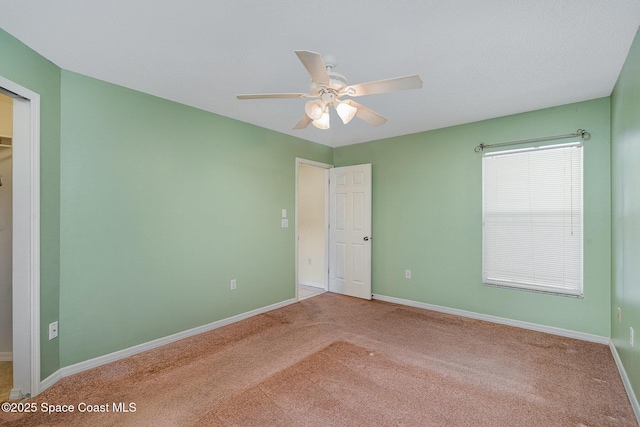 146 Oakcrest Ave NE, Palm Bay, FL 32907 - unfurnished bedroom featuring carpet flooring and ceiling fan