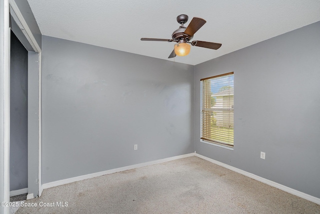 146 Oakcrest Ave NE, Palm Bay, FL 32907 - spare room featuring a ceiling fan and carpet floors