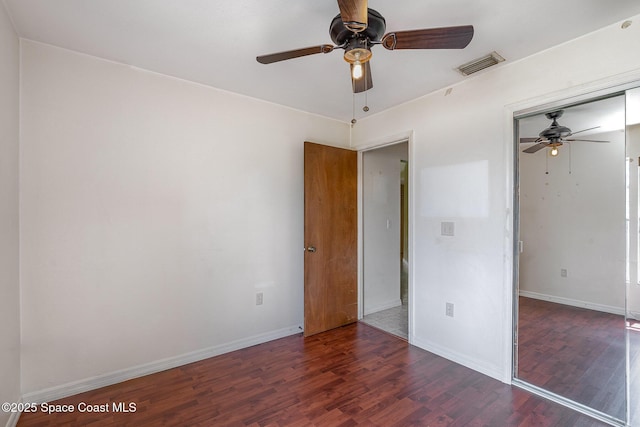 146 Oakcrest Ave NE, Palm Bay, FL 32907 - unfurnished bedroom with wood finished floors, a closet, and ceiling fan