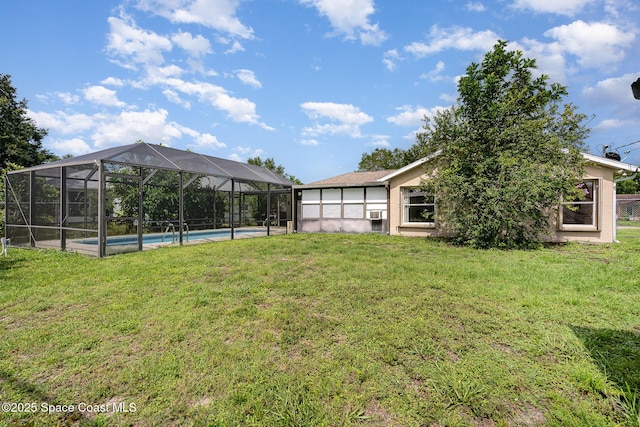 146 Oakcrest Ave NE, Palm Bay, FL 32907 - view of green lawn with an outdoor pool and a lanai