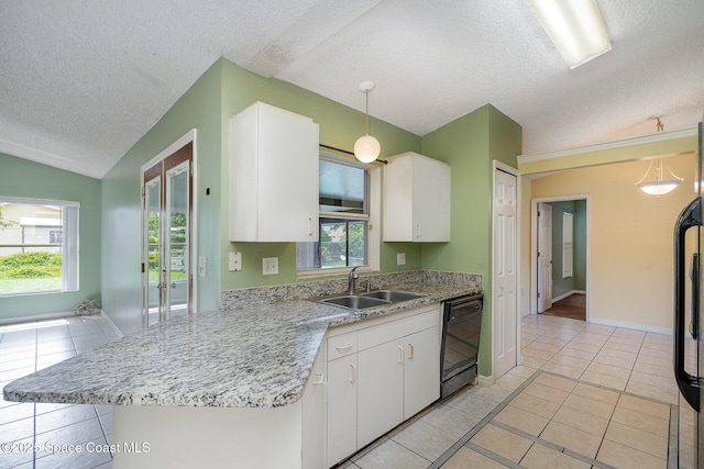 146 Oakcrest Ave NE, Palm Bay, FL 32907 - kitchen with dishwasher, light tile patterned flooring, a textured ceiling, white cabinets, and healthy amount of natural light