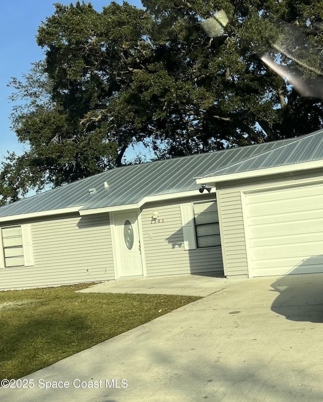 1385 Salerno Ave SE, Palm Bay, FL 32909 - garage with concrete driveway