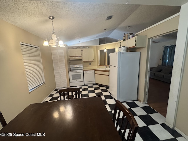 1385 Salerno Ave SE, Palm Bay, FL 32909 - kitchen featuring white appliances, tile patterned floors, lofted ceiling, a chandelier, and under cabinet range hood