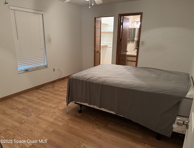 1385 Salerno Ave SE, Palm Bay, FL 32909 - bedroom featuring wood finished floors, ensuite bathroom, and a closet
