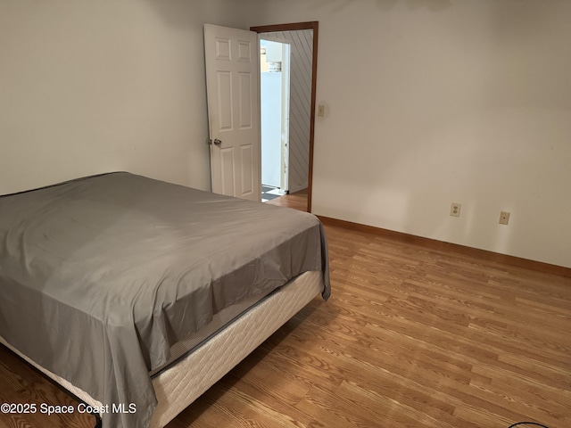 1385 Salerno Ave SE, Palm Bay, FL 32909 - bedroom featuring wood finished floors and baseboards