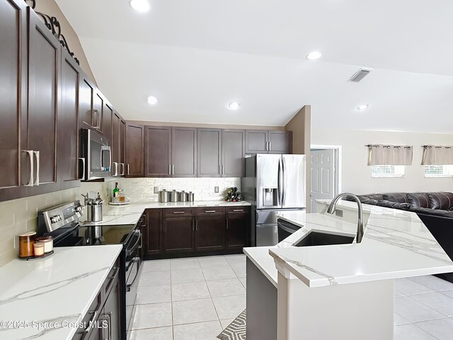 603 Cross Creek Dr, Sebastian, FL 32958 - kitchen featuring appliances with stainless steel finishes, light tile patterned floors, backsplash, and recessed lighting