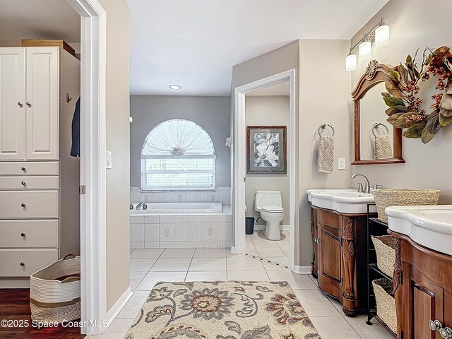 603 Cross Creek Dr, Sebastian, FL 32958 - full bath with two vanities, tile patterned flooring, a garden tub, and recessed lighting
