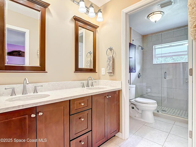 603 Cross Creek Dr, Sebastian, FL 32958 - bathroom featuring tile patterned flooring, double vanity, and a stall shower