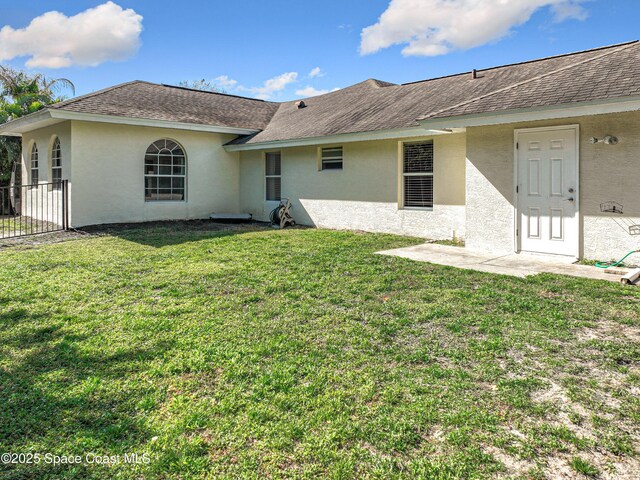 603 Cross Creek Dr, Sebastian, FL 32958 - rear view of property featuring stucco siding and a shingled roof