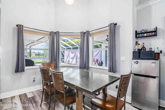 4448 Heaton Park Trl, Rockledge, FL 32955 - dining room with wood finished floors and a towering ceiling