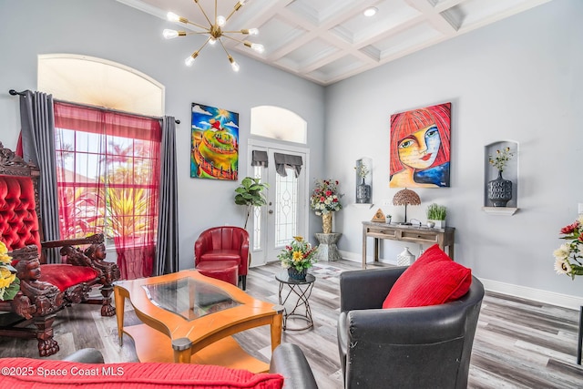 4448 Heaton Park Trl, Rockledge, FL 32955 - living room featuring coffered ceiling, wood finished floors, a chandelier, beam ceiling, and crown molding