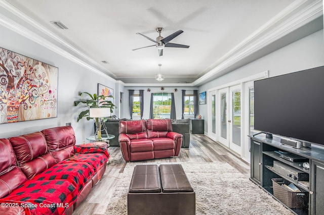 4448 Heaton Park Trl, Rockledge, FL 32955 - living room with french doors, wood finished floors, ornamental molding, and a ceiling fan