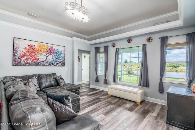 4448 Heaton Park Trl, Rockledge, FL 32955 - living room with ornamental molding and wood finished floors