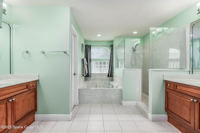 4448 Heaton Park Trl, Rockledge, FL 32955 - bathroom with vanity, a whirlpool tub, a walk in shower, tile patterned floors, and recessed lighting