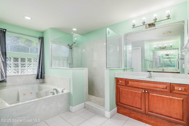 4448 Heaton Park Trl, Rockledge, FL 32955 - bathroom with a tub with jets, a walk in shower, tile patterned floors, and vanity