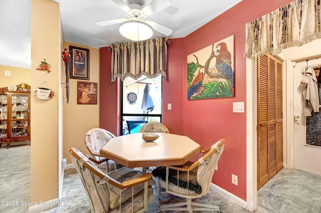 623 Manatee Dr, Satellite Beach, FL 32937 - dining room featuring ceiling fan and baseboards