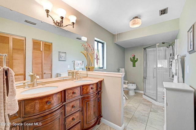 623 Manatee Dr, Satellite Beach, FL 32937 - full bath featuring a bidet, a closet, a stall shower, double vanity, and tile patterned floors