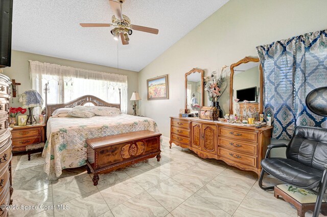 623 Manatee Dr, Satellite Beach, FL 32937 - bedroom featuring lofted ceiling, light marble finish flooring, a textured ceiling, and ceiling fan