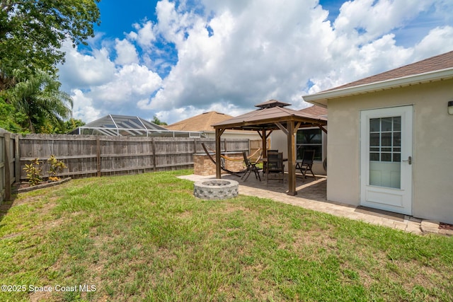 967 Sabal Grove Dr, Rockledge, FL 32955 - fenced backyard with a fire pit, a gazebo, and a patio