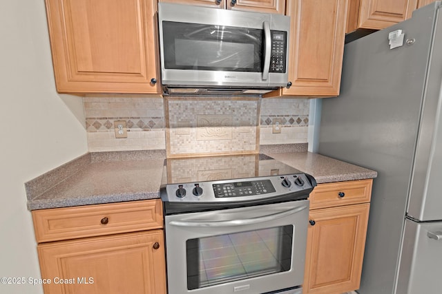 967 Sabal Grove Dr, Rockledge, FL 32955 - kitchen with appliances with stainless steel finishes and decorative backsplash