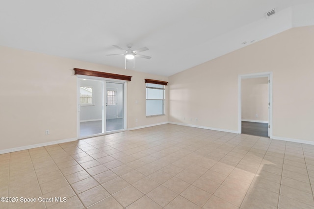 967 Sabal Grove Dr, Rockledge, FL 32955 - spare room featuring ceiling fan, light tile patterned floors, and lofted ceiling