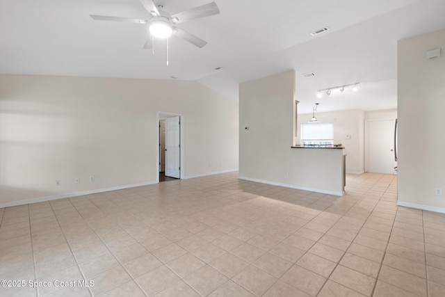 967 Sabal Grove Dr, Rockledge, FL 32955 - unfurnished living room featuring a ceiling fan, lofted ceiling, rail lighting, and light tile patterned flooring