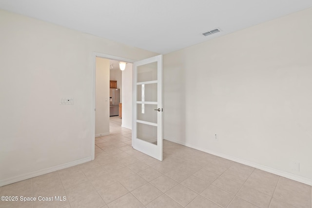 967 Sabal Grove Dr, Rockledge, FL 32955 - empty room featuring baseboards and french doors