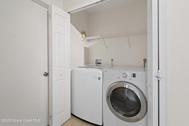 967 Sabal Grove Dr, Rockledge, FL 32955 - washroom featuring separate washer and dryer and light tile patterned flooring