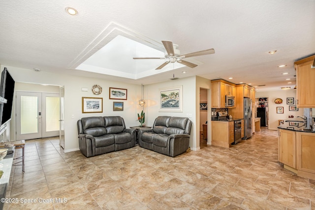 1995 Mark Twain Ln NE, Palm Bay, FL 32905 - living room featuring ceiling fan, a textured ceiling, recessed lighting, and french doors