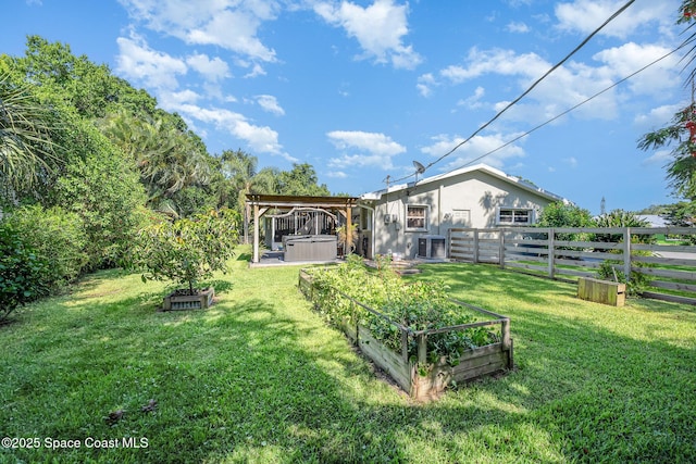 1995 Mark Twain Ln NE, Palm Bay, FL 32905 - fenced yard featuring a hot tub and a garden