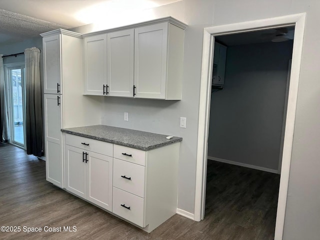 2681 Trammel Ave, Melbourne, FL 32935 - kitchen with dark wood-style flooring