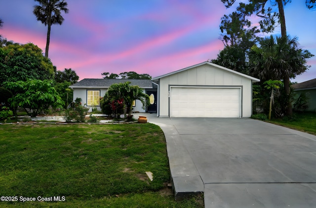458 Stendal Rd NW, Palm Bay, FL 32907 - ranch-style house featuring a garage, concrete driveway, a yard, and board and batten siding