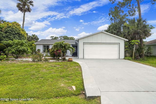 458 Stendal Rd NW, Palm Bay, FL 32907 - single story home featuring a garage, a front yard, driveway, and board and batten siding