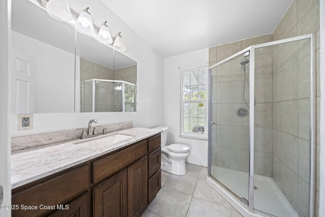 458 Stendal Rd NW, Palm Bay, FL 32907 - full bathroom with vanity, tile patterned flooring, and a shower stall