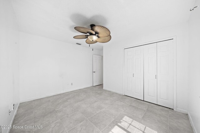 458 Stendal Rd NW, Palm Bay, FL 32907 - unfurnished bedroom with a closet and ceiling fan
