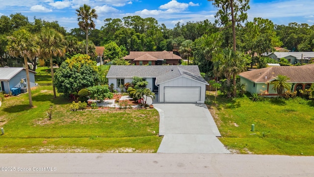458 Stendal Rd NW, Palm Bay, FL 32907 - view of front of property featuring a front lawn, concrete driveway, and view of wooded area