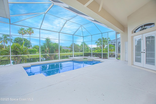 4180 Stoney Point Rd, Melbourne, FL 32940 - view of swimming pool with french doors, a patio, a pool with connected hot tub, and a lanai