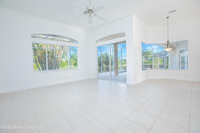 4180 Stoney Point Rd, Melbourne, FL 32940 - empty room featuring light tile patterned floors and a ceiling fan